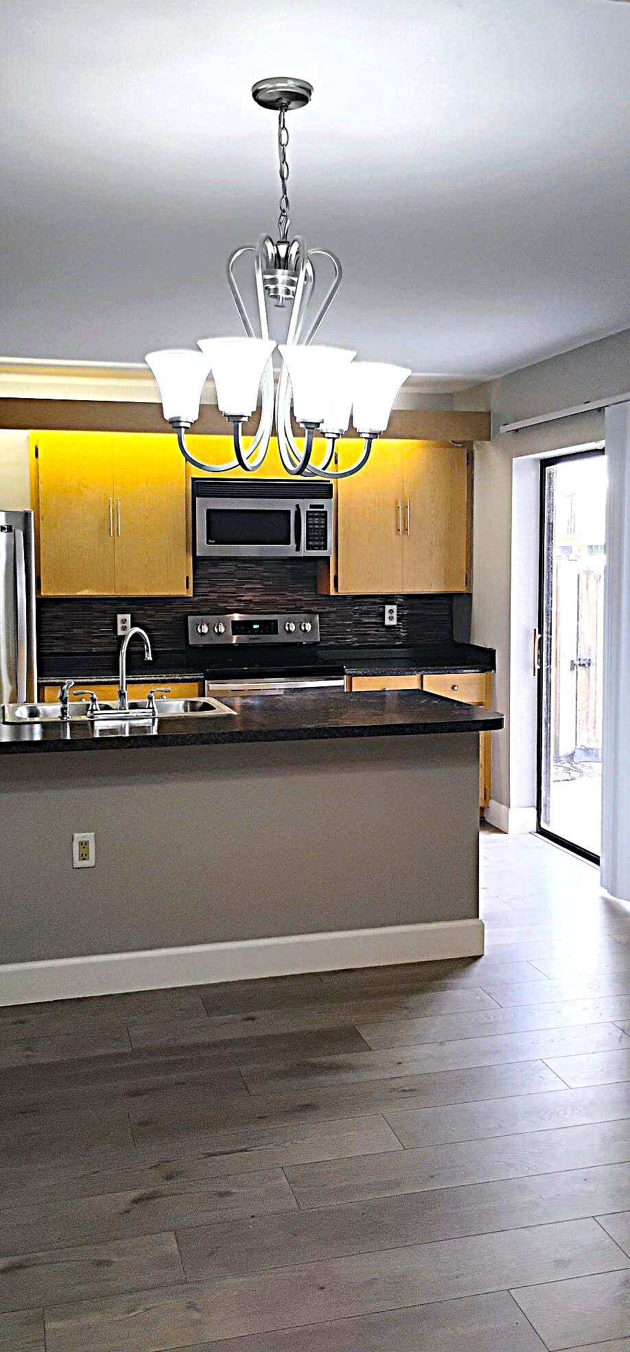 SPACIOUS, UPDATED TOWNHOUSE in the beautiful Village Of Sandalwood Lakes South Community! Updated kitchen w/ stainless steel appliances, over-the-range microwave, mosaic glass backsplash, Laminate floors throughout, walk-in closet, central a/c & heat, ceiling fans, washer & dryer, storage, fenced patio and so much more!!! Call TODAY to schedule a showing!!