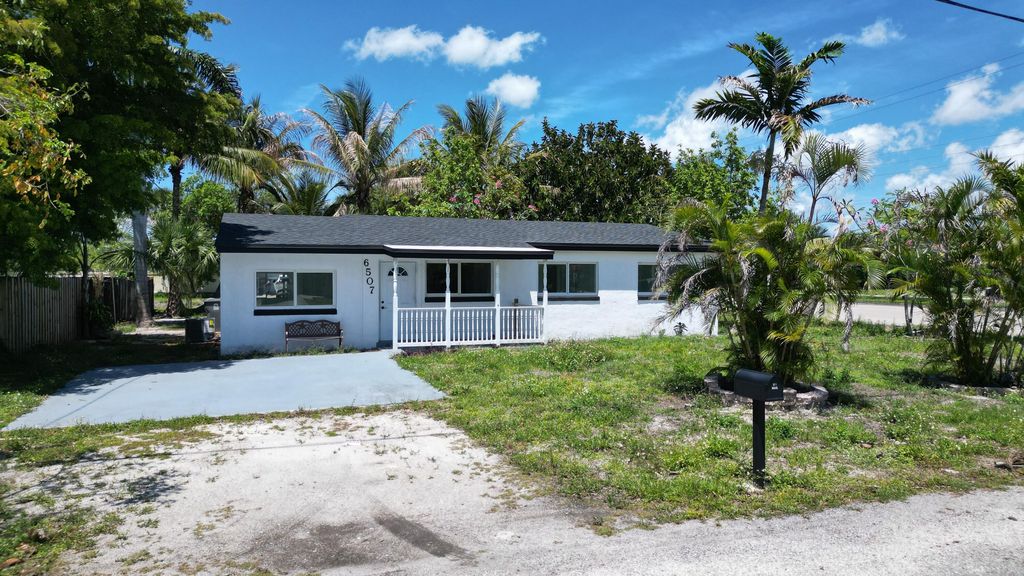 Photo of 6507 Alexander Road, West Palm Beach, FL 33413 (MLS # B26023992)
