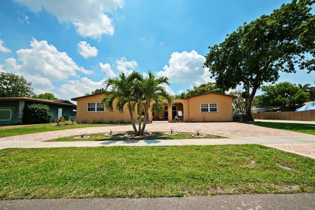 Photo of 8350 NW 23rd Street, Pembroke Pines, FL 33024 (MLS # B26024758)