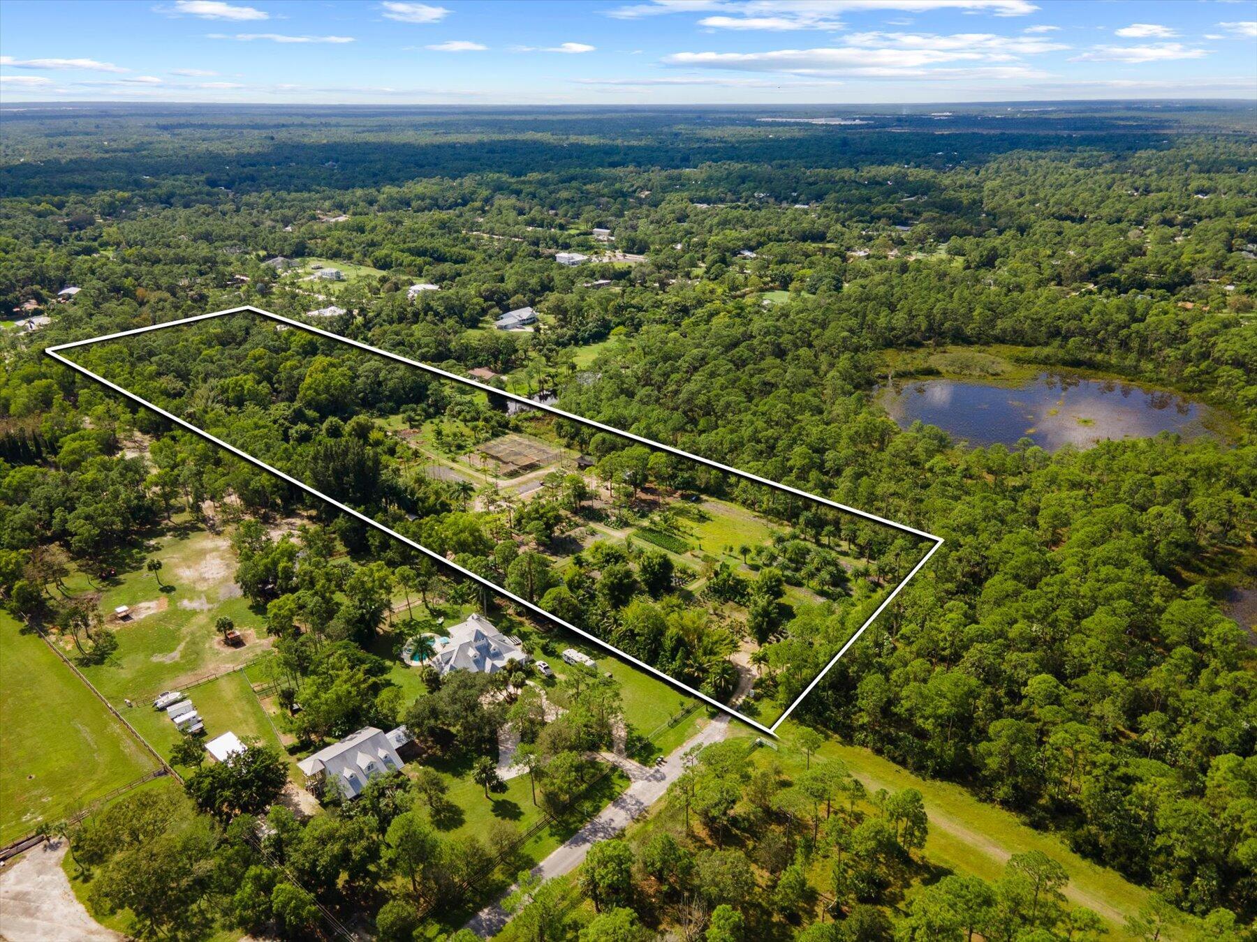 Exceptional opportunity to own the best 10 acre lot in the ranch estates of Rocky Pines in Jupiter, and one of the best 10 acre lots anywhere in Palm Beach County! Enjoy unparalleled PRIVACY, SECLUSION and TRANQUILITY amidst a beautiful mature tropical landscape at the end of a paved dead-end road, backing up to a preserve to the West and a canal to the South. You will fall in love; endless possibilities to develop a family compound, a luxury resort estate, equestrian center, farm, botanical garden, nursery, permitted business or all of the above high and dry property with full 10 acres useable providing great versatility. A nature lover, gardener and equestrian's PARADISE. Fully fenced, with motorized gate and irrigation system. This property is truly 10 acres of paradise!