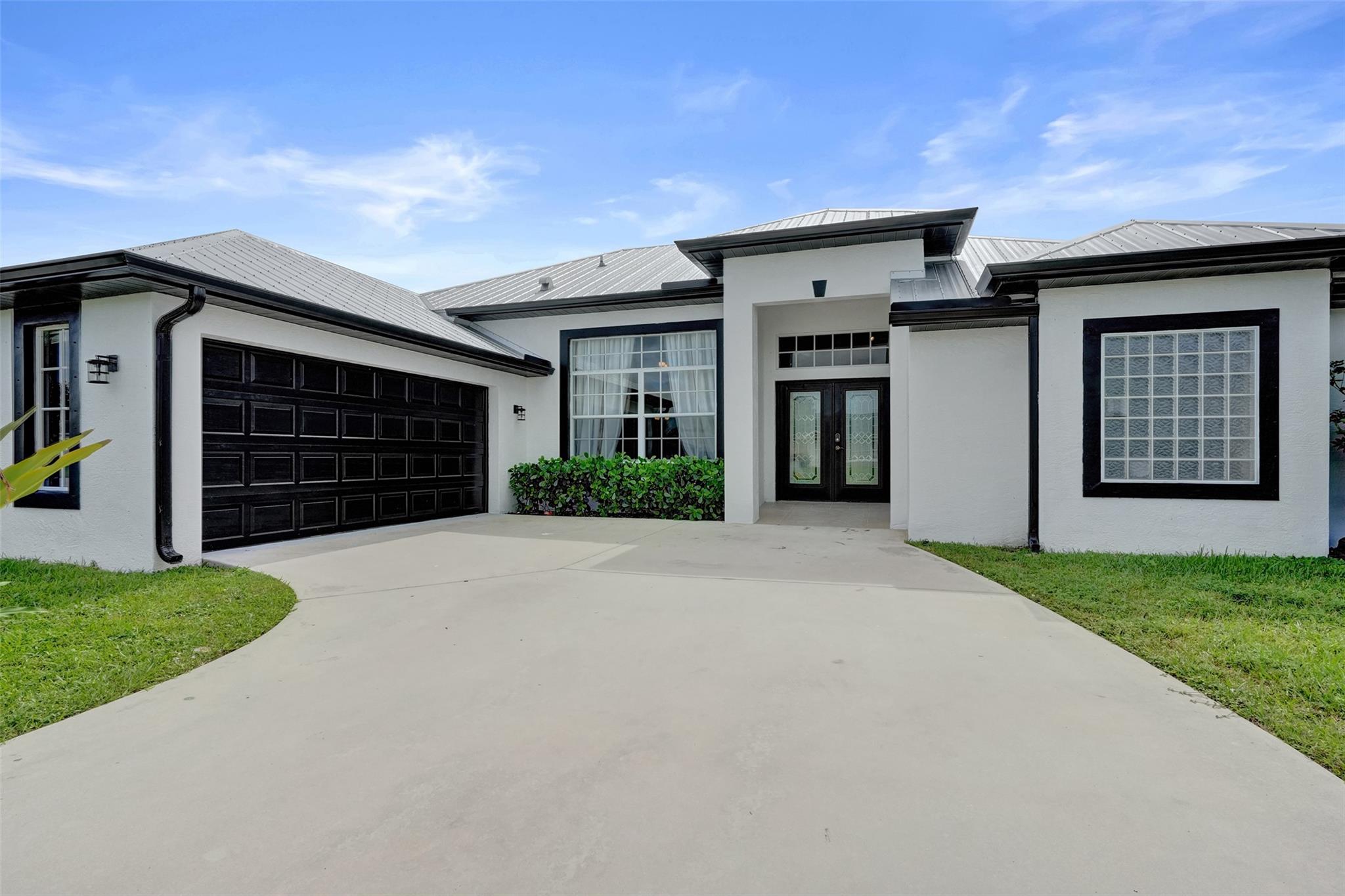 Experience luxury living in this stunning 4-bedroom, 2-bathroom home featuring a brand-new kitchen with white cabinets, granite countertops, and a large eat-in island perfect for entertaining. Enjoy a spacious open floor plan with new luxury vinyl flooring, two living areas, and plenty of natural light. The primary suite offers dual walk-in closets, double vanities, a soaking tub, and a separate shower. Step outside to a large patio and backyard with room for a pool and five separate access points. The garage has been converted into a stylish movie and game room, and the furniture is negotiable at no additional cost. With a two-car garage, extended driveway, and no HOA. This home is in a prime location. A true must-see, schedule your private tour today and make this dream home yours!