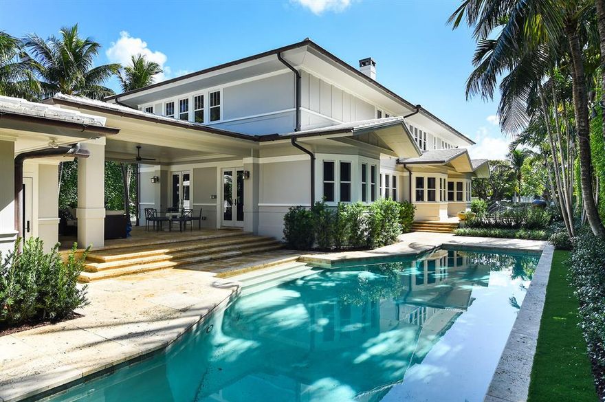 Spectacular Beach House in pristine condition, beautifully redesigned by Marc-Michaels Interior Designs. Situated on lovely In-Town Ocean Block Clarke Avenue. Gorgeous estate features 5 bedrooms and 6 and a half baths. Stunning, large Master Suite features fireplace, sitting room, and dual baths and walk-in closets. Every need is accounted for, with an elevator, full house generator, and two car garage that is conveniently accessible via service drive. Estate features fabulous entertaining areas, including oversized living room with fireplace, library with wet bar, and window-lined family room that leads to open patio and covered loggia. Chef's paradise with top-of-the-line appliances, eat-in kitchen with island, breakfast nook, and formal dining room. Guest House with living room, bedroom, and en-suite bath. Oversized 45' swimming pool and full cabana bath. **To be sold As Is. All sizes approximate and subject to errors and verification. Square Footage for main house + guest house as per County Tax Rolls.