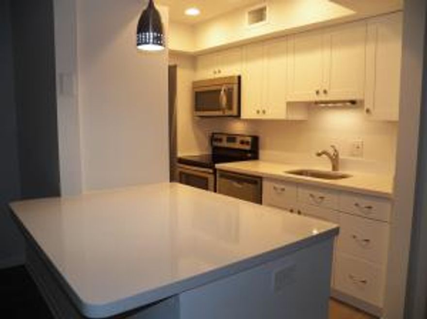 CASH ONLY FOR A QUICK SALE!  This beautiful unit has had a top to bottom renovation. All new 2015 permitted and up to current code: Light and bright kitchen with open kitchen bar; quartz countertops; stainless steel Whirlpool appliances with side by side refrigerator and upgraded cabinet depth so they won't stick out and in your way; 6 recessed lights for great lighting; All new bathroom with shower; glass tile shower floor with inlay in wall tile; and a mix of subway and diagonal tile on the walls; new cabinet with soft close doors; toilet; ceiling; ventilation; porcelain tile that looks like marble but is easy to clean; Grey wood laminate throughout the rest of the condo including in the utility closet; New AC and ductwork; New hot water heater; All new light fixtures and elec. outlet covers; wood baseboards widecorative edging; freshly painted. Newback screened patio and even the storage closet has been updated. View of the pool right out your back door and right next to the clean laundry room. This is a maintenance free home; even the light bulbs are LED. Great location across from marina with dry boat storage with ocean access; Frigates; walking distance to everything including Publix; IHOP; the library; banking; Subway and more. Low electric as the unit is shaded by the front entry. This is a must see. This condo development is very well maintained; it is very clean and you will be proud to bring your friends to see your new home. All work done on this unit has been done by a licensed General Contractor and is permitted and up to 2015 code. Don't miss this one.