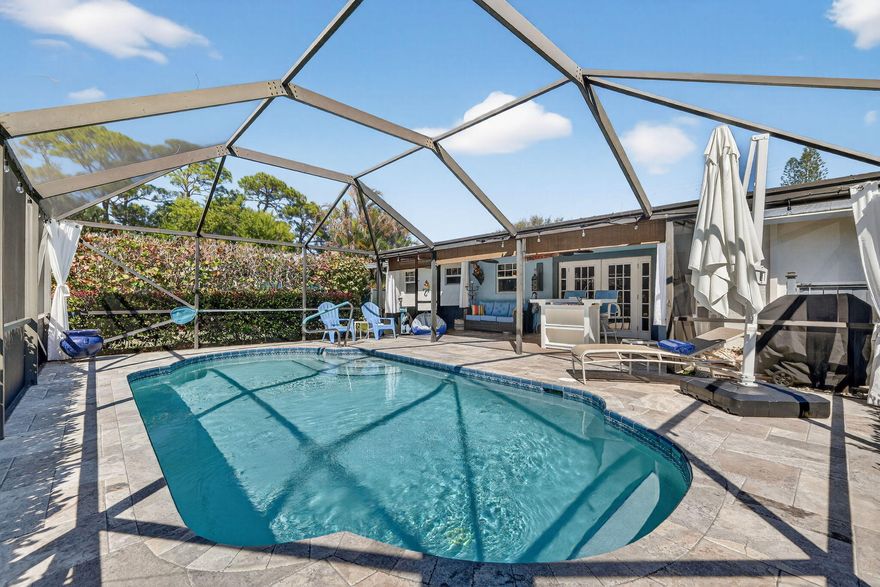 Beautiful Home in Great Stuart Location Featuring Heated In-Ground Screened Pool, Perfect for Year-Round Florida Living and Entertaining. This Immaculate Property Offers Laminate and Tile Flooring Throughout for Easy Maintenance. Kitchen Features Granite Countertops With Plenty of Workspace. Den or Entertainment Room Provides Additional Flexible Living Space. Upgrades Include Metal Roof and Impact Windows for Energy Efficiency and Storm Protection. Screened Pool Area Creates Private Outdoor Space Ideal for Relaxing or Entertaining. Conveniently Located Near Shopping, Dining, Parks, Boating, and Stuart's Beautiful Beaches. Enjoy Florida Living at Its Best in This Move-In Ready Pool Home.