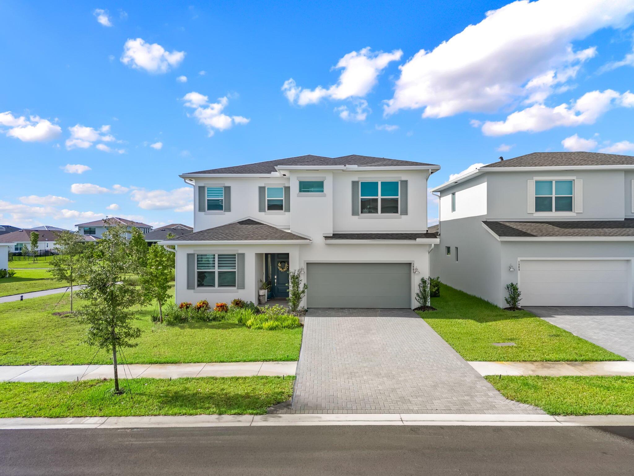 Welcome to this brand-new construction home located in the sought-after Arden community of Loxahatchee. This beautifully designed residence offers 3 bedrooms, 3 bathrooms, plus a versatile den/office, with a spacious open-concept layout ideal for seasonal living. The modern kitchen features stainless steel appliances, quartz countertops, and a large island perfect for entertaining. Bright living and dining areas flow seamlessly to the covered patio and backyard. The home boasts a luxurious primary suite with a walk-in closet and spa-style bathroom, along with two additional bedrooms and a flexible den that can serve as a home office or guest space. High ceilings, stylish finishes, and ample storage make this home both elegant and functional. Schedule your privcate showing today!