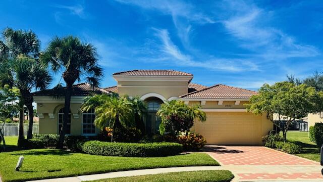 Larger Montego Model with views, 3 full Bedrooms, 2 Full baths and 2 (1/2 baths), Completely fenced in yard. This home has many upgraded options from the builder incl Gourmet kitchen with SS Appliances, Double wall ovens, Granite Counter tops W natural stone backsplash and more. FINSHED enclosed porch with A/C, 250 ft . Xtra paver outdoor patio Elegant light fixtures, blinds, Formal Dining rm, plus the main bath has 2 walk in closets, custom mirrors, glass shower connects the 2 toilet areas, transom windows allow lots of light.Buena Vida is a gated 55+ community with Fabulous amenities incl 2 pools, on site cafe, pickleball, tennis, gym, card rooms, more. Great location with so much nearby. Close to roads, shopping, airports : approx. 20 min to PBI,, 45 (FLL), & 75 minutes to (MIA).