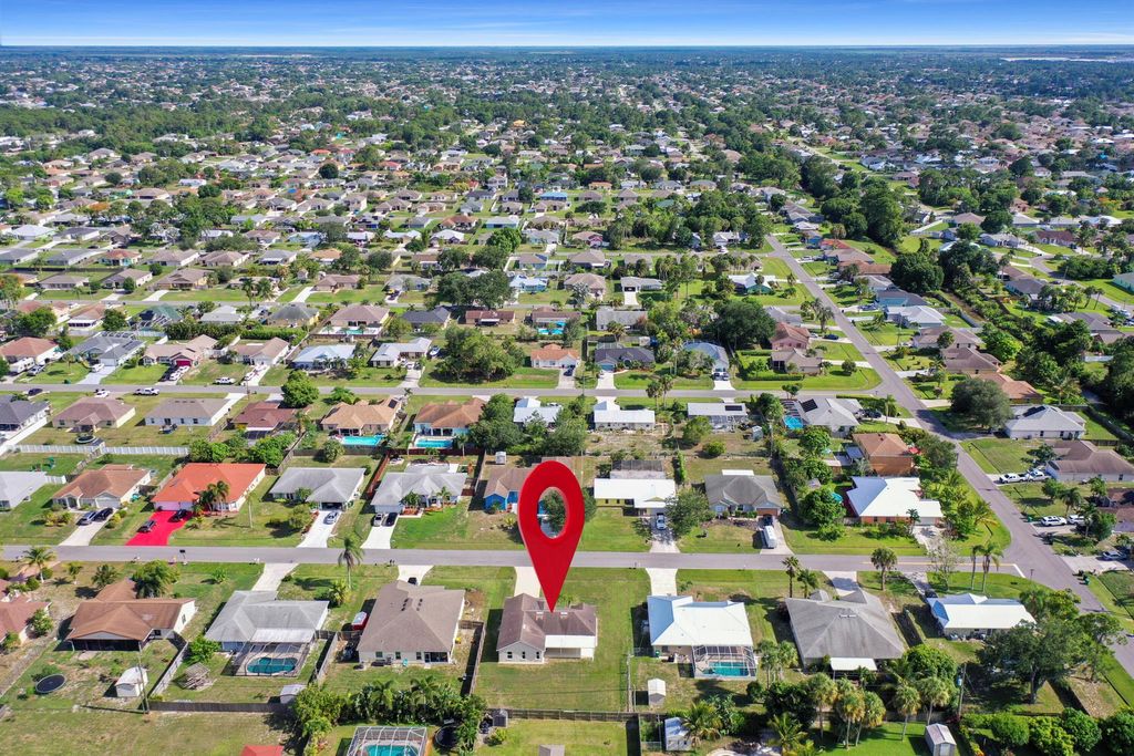 Photo of 1065 SW Aswan Avenue, Port Saint Lucie, FL 34953 (MLS # R10997789)
