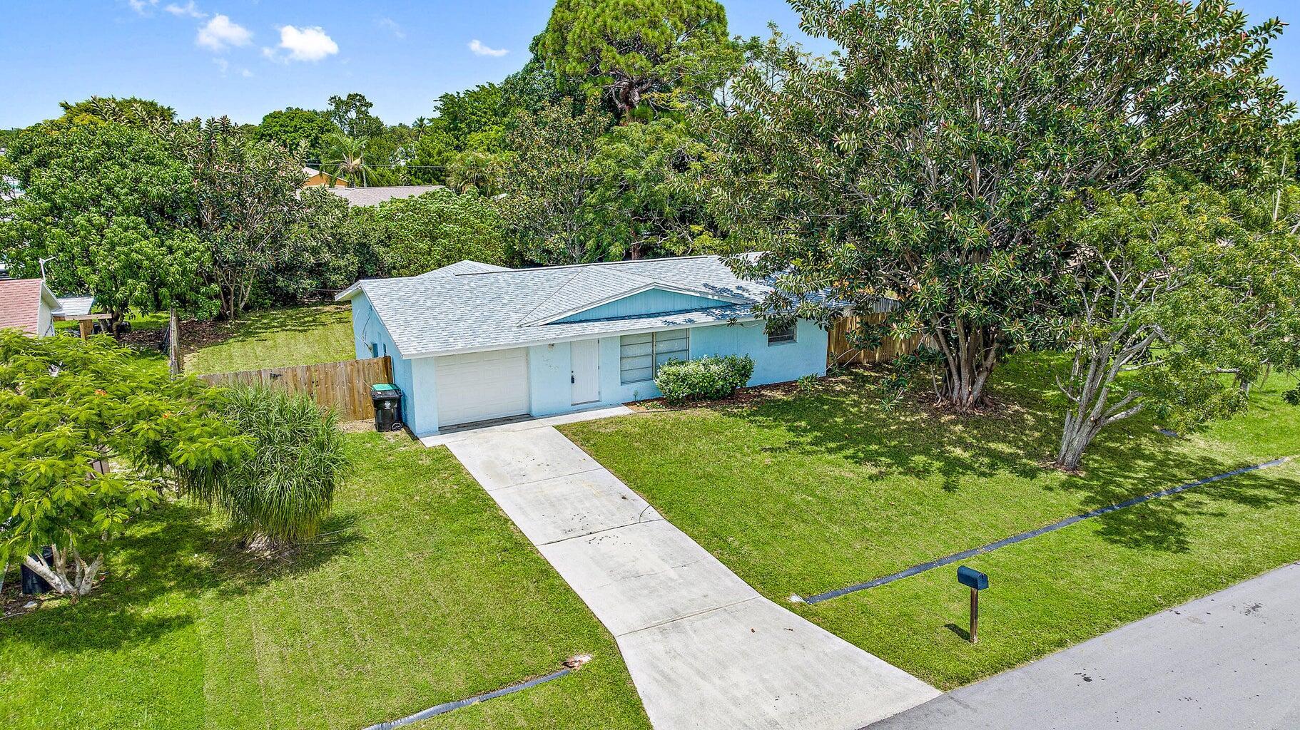 New roof 2023, New a/c 2021, New hot water heater 2024, all New stainless steel appliances 2025, New washer & dryer 2024, New kitchen faucet & garbage disposal 2024, New cypress wood plank patio ceiling & outdoor fan 2025. Move right in with all major expenses having been recently taken of in this CBS- Concrete Block single family home with 2 bedrooms, 2 full bathrooms & a 1 car garage! There is tile throughout the whole home & it sits on a 10,000sq ft lot with a fully fenced large backyard with mature trees & a screened in patio! There is also a built in work bench in the garage & an accent wall has been added to the kitchen! There is NO HOA, so bring your toys & enjoy the long drive way for additional vehicle/recreational storage! You will not want to miss this turnkey home!