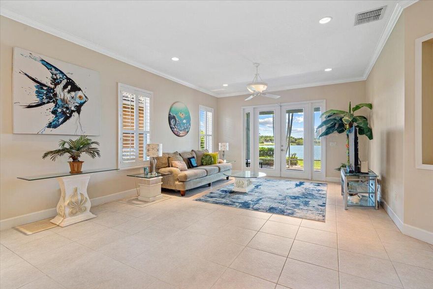Beautiful 3BR/3.5BA courtyard pool home just steps from Pepper Park & the Navy SEAL Museum! Enjoy river & beach access w/ available boat slips & private walkway to the sand. Set on an extended lot w/ green space in front & tranquil lake views in back. Private screened courtyard features a pool, summer kitchen, outdoor shower & pool bath--perfect for entertaining. Interior highlights include volume ceilings, crown molding, tile floors & plantation shutters. Updated kitchen offers granite counters, SS appliances, walk-in pantry, snack bar & breakfast nook. Spacious great room overlooks the lake, primary suite opens to lanai, plus 2 guest rooms w/ courtyard access (1 en-suite). Updated laundry. Accordion shutters for peace of mind.