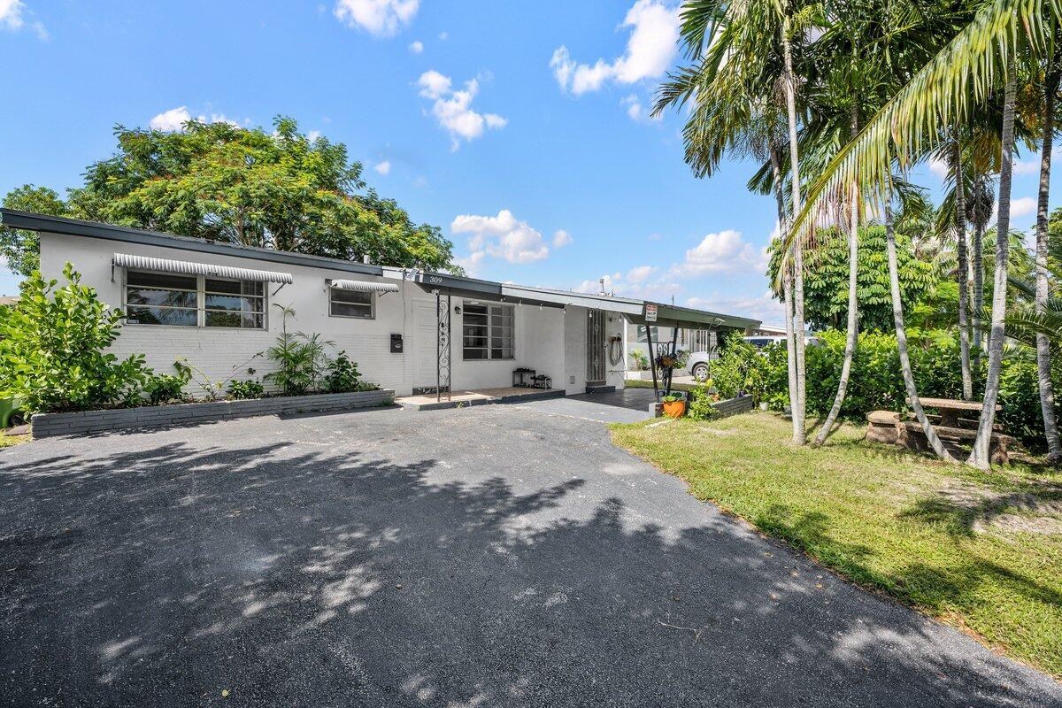 Fantastic 3 bedroom, 2 bath home featuring a bright, open layout and an updated kitchen with ample storage. Just minutes from beaches, Gulfstream Park, dining, shopping, and major highways. Offered individually or as a package deal with 313 SW 7 St (MLS# RX-11109689) Both properties together generate approximately $104,400 in combined rental income.Whether you are an investor seeking strong rental income or a multi generational family looking for the perfect setup, this property offers endless potential.