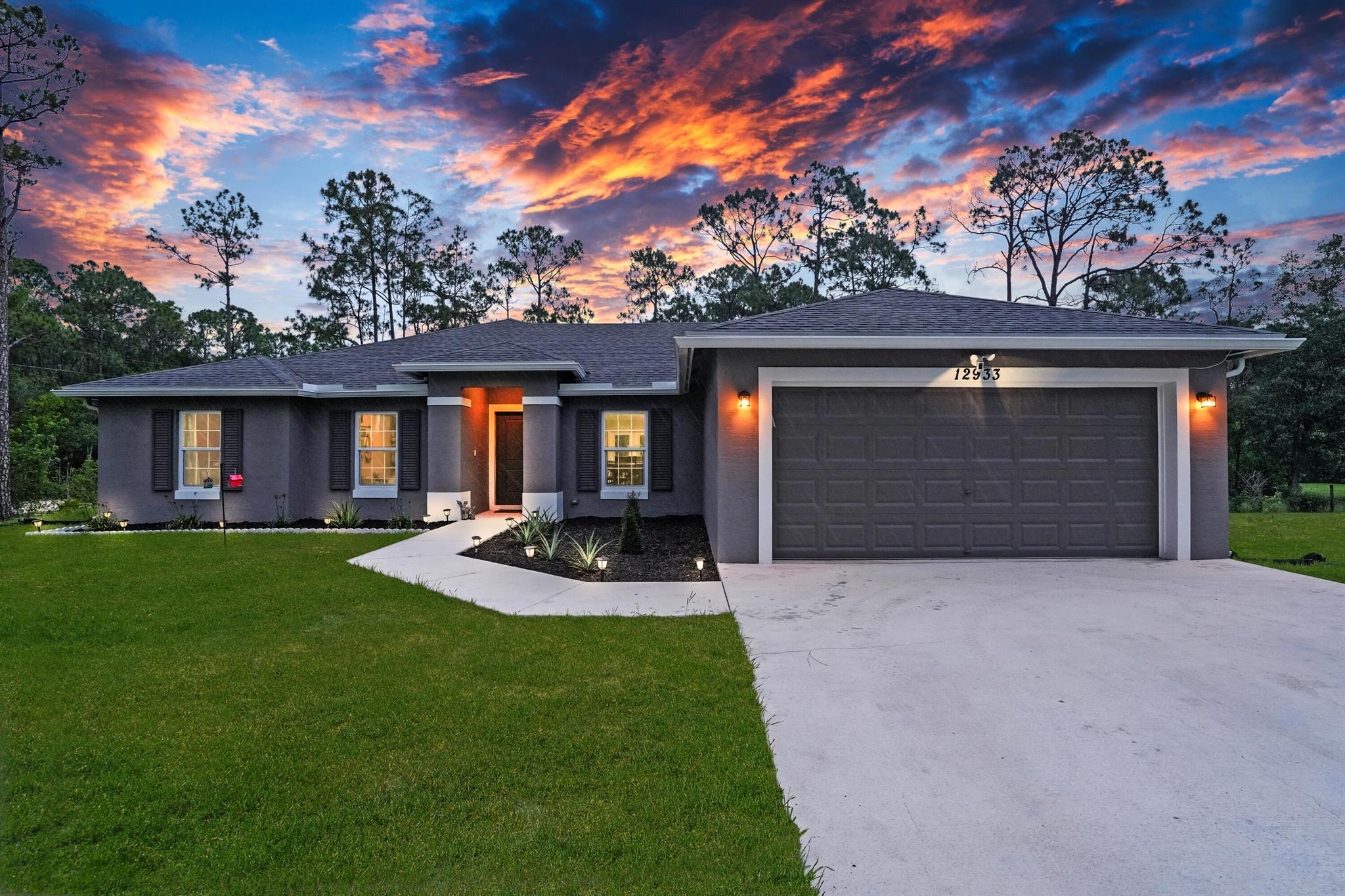 NEW CONSTRUCTION 2024! 4 bed PLUS OFFICE, 3 Bath CBS w/Impact Glass, up to 12' ceilings, premium fixtures & plank tile throughout perched high on 1.25 acres in Jupiter Farms! Inside, a great room concept w/ spacious living room, office & formal dining room all viewed from the kitchen. It is equipped w/ 6 seat island, soft close cabinets & drawers, DREAM walk-in pantry, granite counters and stainless appliances. A full bath w/ 2x vanity serves 2 large bedrooms, while the 3rd guest bedroom is adjacent a full bath that doubles as a cabana w/ a nearby door to a covered patio that overlooks your expansive backyard dotted w/rustic pines. The MAIN bedroom is a dream w/ a walk-in closet we dare you to try and fill, a 2nd closet, 2x vanities, glass shower, soaking tub and trey ceilings. THIS IS IT