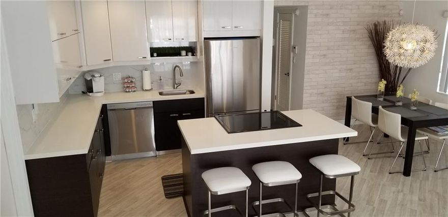 DON'T MISS THIS GORGOUS 1/1 RENOVATED 1st FLOOR CORNER with impact windows and door!! Beautiful European styling cabinets w/ white quartz countertops, light floors , custom interior doors and built-ins make a real statement!  This exceptional 16-unit building on a canal allows you to have a boat up to 30' with 1-fixed bridge!  You'll love the convenience to restaurants, shopping and the BEACH!  Pet Friendly w/ some restrictions.  Financially solid + passed its 40-year inspection W/ LOW HOA dues.  MUST OWN FOR 1-YR BEFORE RENTING. Ready for season and immediate occupancy. Amenities: pool, on-site laundry, BBQ, waterside dining. Parking in front of the building.   You will love being so close to Lauderdale-By-The Sea!! CONTACT Mgmt w/ANY QUESTIONS. Please submit Far Bar As-Is offers with proof of funds or loan pre-approval attached. Listing information is deemed reliable however the buyer is responsible for verification and due diligence. Seller does not warrant the accuracy of fees & measurements, as the information provided is for information only. PLEASE CONFIRM WITH HOA and application to HOA thru ******myusaservices.com.