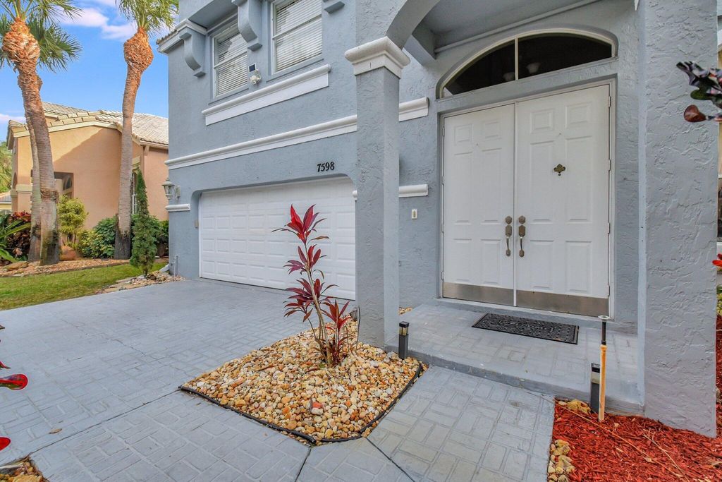 Photo of 7598 Downwinds Lane, Lake Worth, FL 33467 (MLS # R11045384)