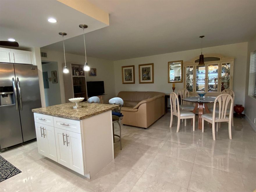 Step into this adorable, fully furnished corner unit in Century Village East’s desirable 55+ community! This first-floor condo is spotless and perfectly situated just steps from the pool and clubhouse. It offers an updated kitchen with a stylish island, two full baths, hurricane shutters, flat-screen TVs, and an enclosed patio. With plenty of storage and a cozy, welcoming vibe, this immaculate condo is the perfect place to call home.