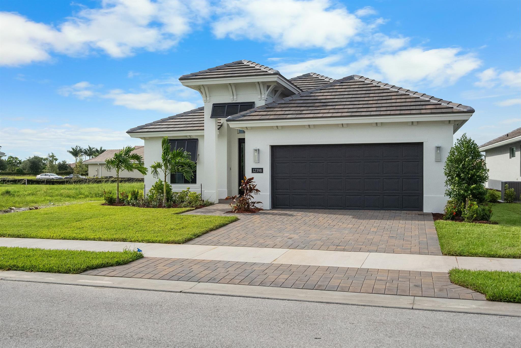 PRICE IMPROVEMENT FROM $531,385 REDUCED to $501,385!!!Do not miss this MOVE-IN READY NEW HOME by GHO Homes! This beautifully upgraded three bedroom home features beautiful tile flooring throughout. Custom kitchen and bath cabinetry with Quartz countertops. The home offers a spectacular southwest exposure with long lake lake view. Impact glass throughout this SMART home with NEST thermostat, video doorbell & digital locks and garage door opener.Discover the pinnacle of 55+ living in Port St. Lucie at the Lake Park at Tradition new home community, where luxury meets convenience in a vibrant, gated neighborhood. Nestled within minutes of premier shopping, entertainment, and dining options, our community offers an unparalleled living experience tailored to active adults.