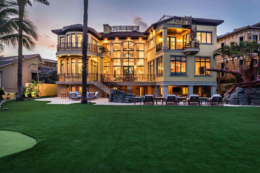 PROPERTY IS RENTED TIL APRIL 30, 2020. Sited on over a ½ acre oceanfront lot, this estate with private elevator has magnificent ocean, Hillsboro Inlet and lighthouse views from all main rooms. The manicured backyard feels like a five star resort complete with putting green and tropical palms that enhance its beachfront locale. This 2004 estate with 7,962 square feet of air-conditioned living space, has been recently renovated with brand new roof and interior designer finishes. Stone floors, hurricane impact windows and doors throughout, private 7-seat home theater & game room, and a gym. 
The property was part of a trade so that the sold price may not accurately depict the actual value of the home