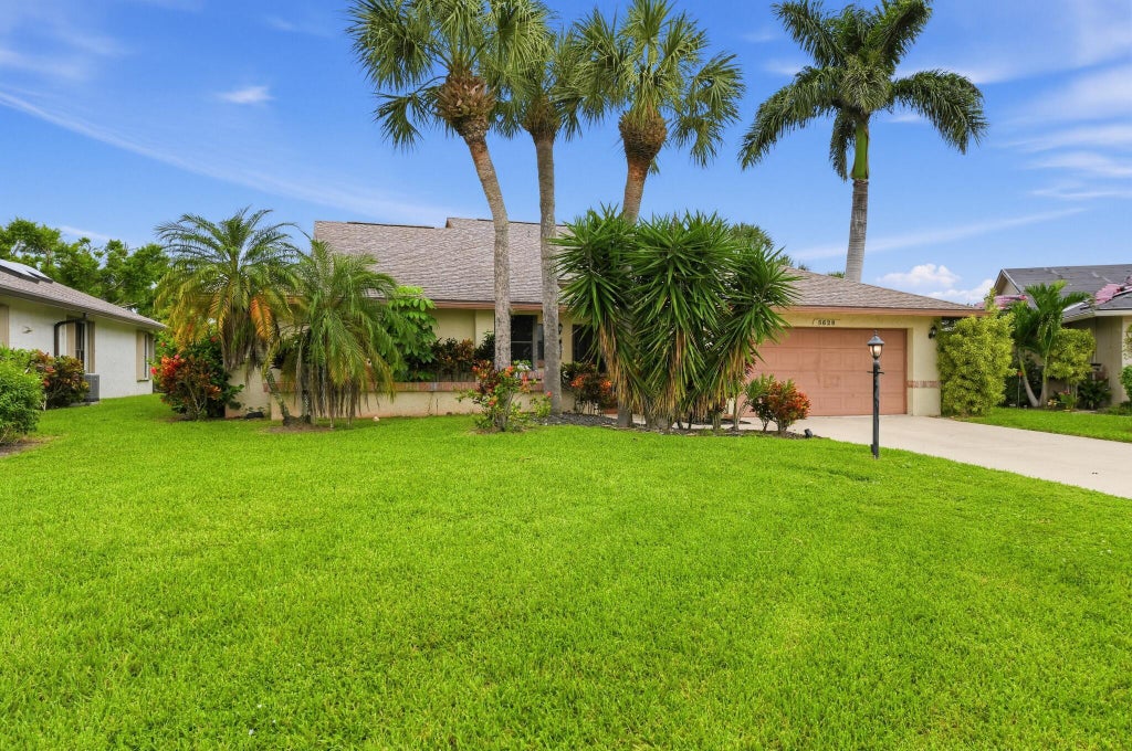 Photo of 5628 Pleasant Valley Lane, Delray Beach, FL 33484 (MLS # B26083101)