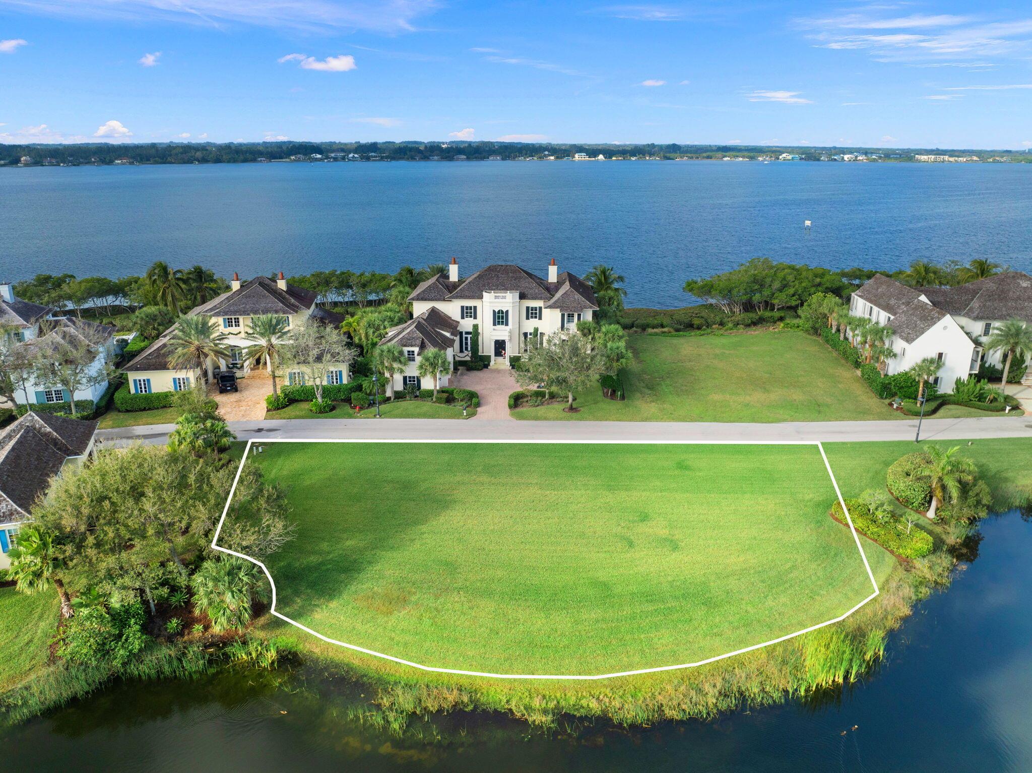 Build your coastal dream home on this stunning .29-acre waterfront lot, one of the last two remaining Lake Lots! Nestled within an exclusive gated island community on the Intracoastal, this property offers enhanced privacy with no neighbors to the north, surrounded by multimillion-dollar luxury homes. Build a minimum 2,500 sqft home or larger, with optional 1.5-story design for added space! Enjoy serene sunrise and sunset views, a lake refreshed daily by tides, and an ideal pool set back just 5 feet from the property line. Slips at the on-site marina are available for lease or purchase. Begin construction with ease - an updated survey and approved builder list are available. Experience the vibrant old-Florida charm of Vero Beach boutiques, markets, theatre and fine dining!