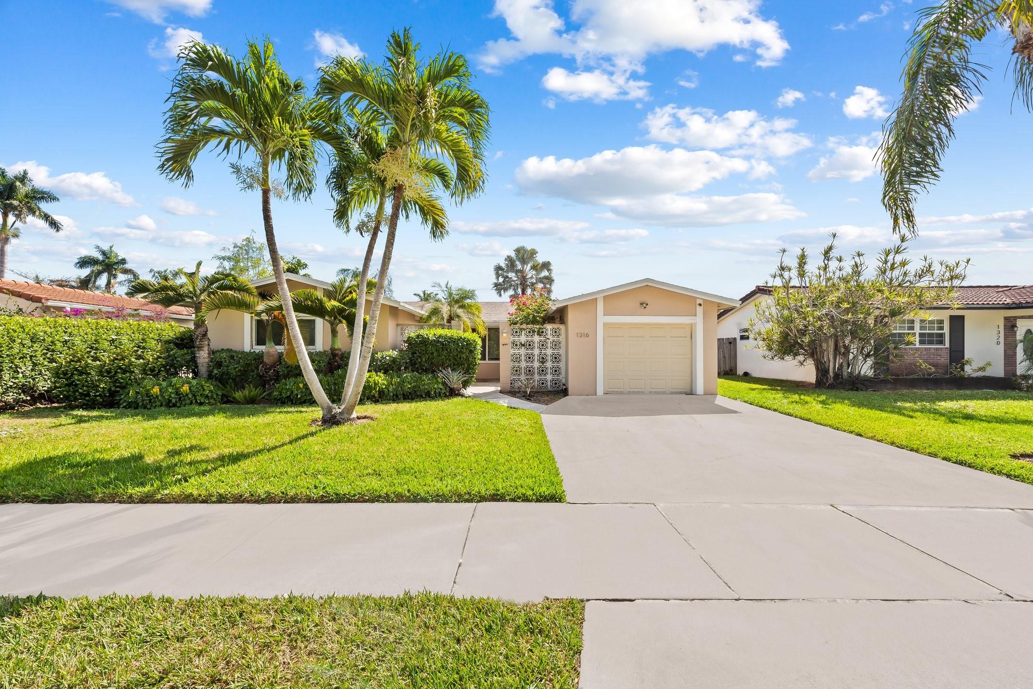 TOTALLY REMODELED 3/2 WITH 1 CAR GARAGE LOCATED RIGHT ACROSS THE STREET FROM THE GOLF COURSE. OPEN KITCHEN OFFERS QUARTZ COUNTER TOPS WITH ISLAND, NEW CABINETS, AND ALL STAINLESS STEEL UPGRADED GE APPLIANCES. BEAUTIFUL TERRAZZO FLOORING THROUGHOUT. PLANTATION SHUTTERS, IMPACT GLASS/HURRICANE ACCORDION SHUTTERS, AND ALL NEW RECESSED LIGHTING. NEW ROOF!!! NEW PIPING!!! FROM THE KITCHEN/FAMILY ROOM, FRENCH DOORS LEAD OUT TO A LARGE COVERED WOODEN DECK PATIO AREA WITH PLENTY OF ROOM FOR A POOL. 100% FENCED IN. THE PROPERTY IS LOCATED JUST 1.5 MILES FROM THE OCEAN AND MINUTES FROM THE AIRPORT, ENTERTAINMENT, AND FINE DINING.