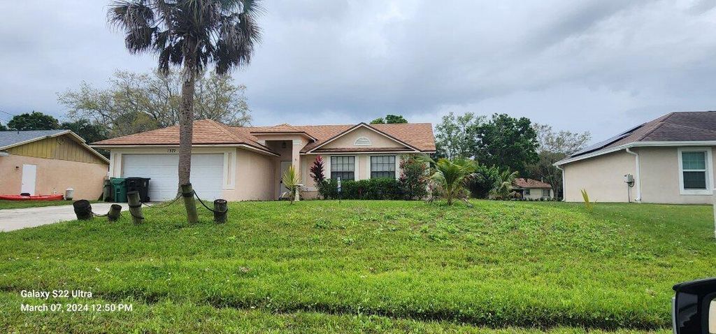 Photo of 1372 SW Sudder Avenue, Port Saint Lucie, FL 34953 (MLS # R10970132)