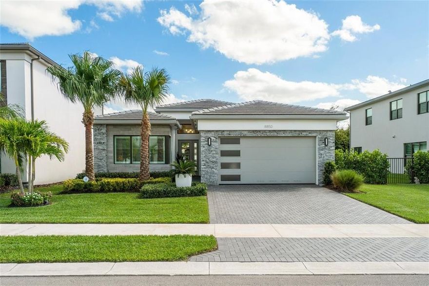 This immaculate, expanded Maui model in Boca’s coveted Lotus community presents like a show home: Sleek, clean, and modern with all the designer touches you’d expect of Boca’s hottest new contemporary resort property. With an enlarged garage, eat-in kitchen with oversized island, and closets like celebrity dressing rooms, every inch has been optimized for lifestyle. 14’ ceilings bejeweled with luxe light fixtures open to an outdoor kitchen with sink, built-in grill, and a private backyard with plenty of room for a pool. Beyond your front door is country-club living without the dues: a huge designer clubhouse, 8 acres of athletic space, resort-style pool and spa with poolside cafe, state-of-the-art fitness center, and indoor/outdoor playgrounds for the kids. You’ll never want to leave!