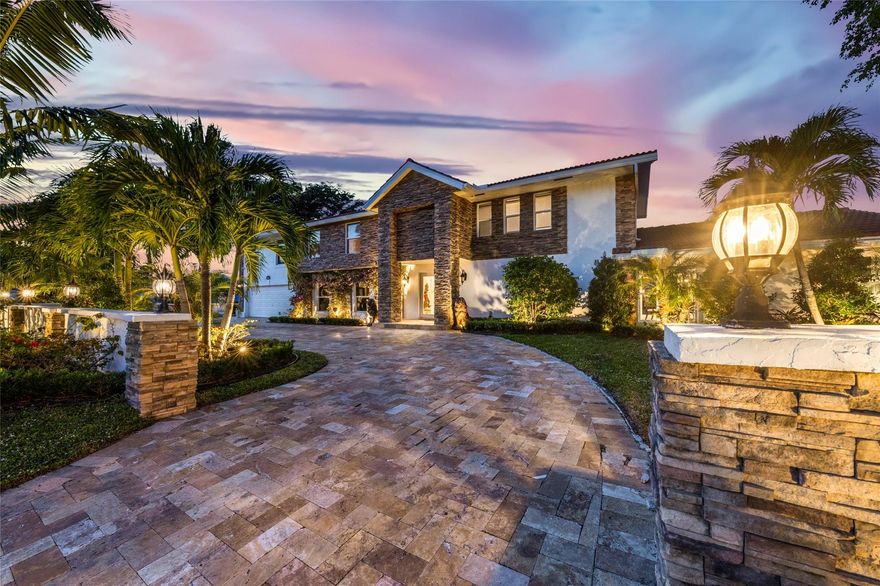Discover the pinnacle of waterfront luxury in sought-after Santa Barbara Shores! This 4-bedroom, 4-bath home offers an oversized den, a 2-car garage, and stunning marble floors that exude elegance. The expansive primary suite boasts walk-in closets and a spa-like bath fit for a five-star retreat. Boater's paradise with DIRECT OCEAN ACCESS WITH NO FIXED BRIDGES! Minutes from the Hillsboro Inlet. Step into a Mediterranean-inspired backyard, with a sparkling pool, spa, lush landscaping, and a private 55FT dock. Designed for effortless entertaining, this home features a spacious floor plan, formal dining room, a fireplace, and a chic wet bar. With impact windows and doors, plus a prime location near the beach, shopping, dining, and the airport, this is the ultimate South Florida dream home!