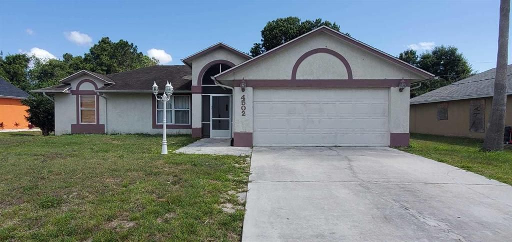 Photo of 4502 NW Alsace Avenue, Port Saint Lucie, FL 34983 (MLS # R10717940)