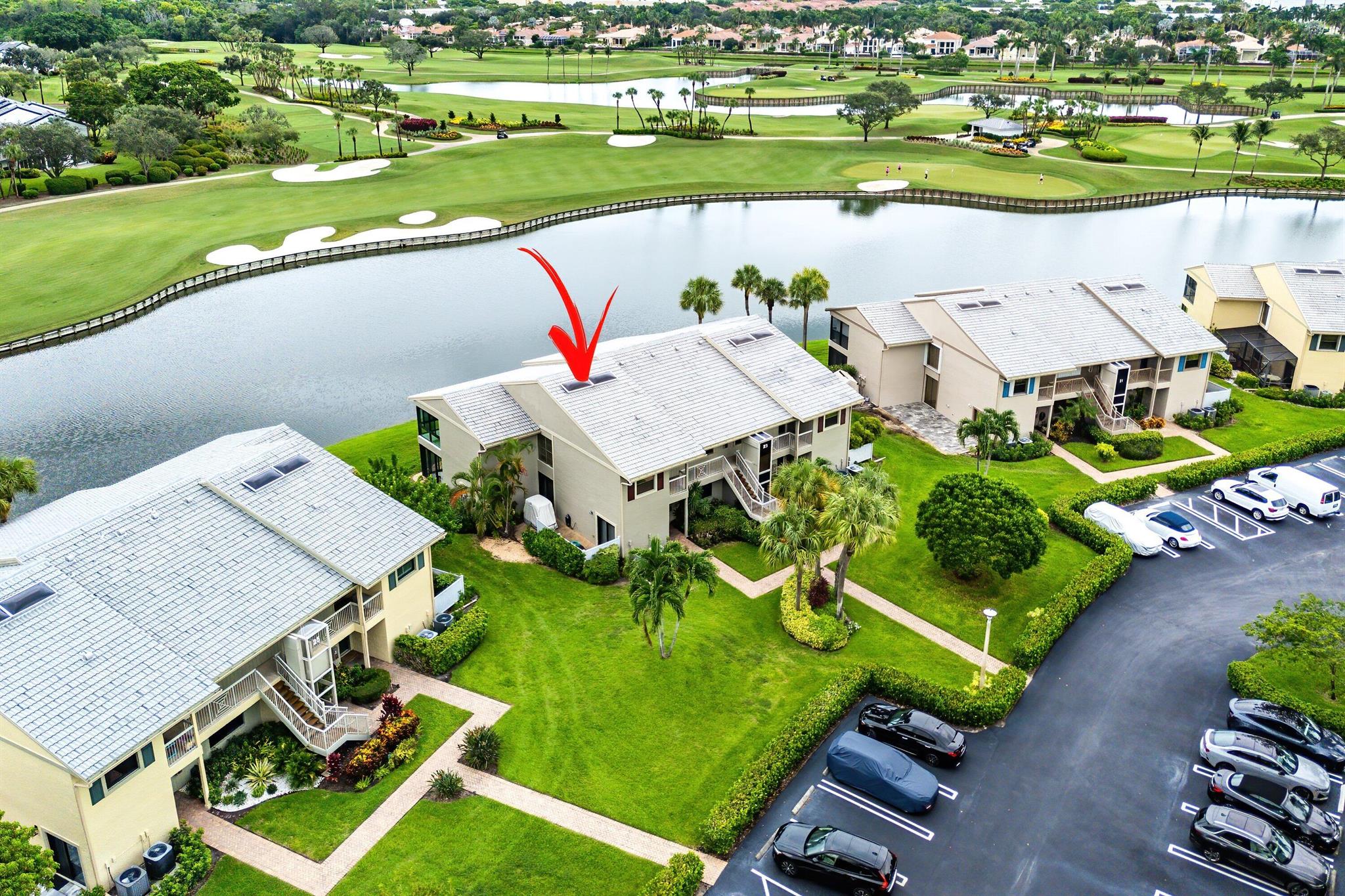 Fully furnished, first-floor, true 3-bedroom condo with ultra-premium views in Eastgate at Hunters Run Country Club. This updated residence spans 2,106 square feet, offering an extended living room and stunning panoramic views of the water and East golf course. The interior is thoughtfully designed, featuring recessed lighting, crown molding, porcelain tile flooring, and plush carpeted bedrooms. The eat-in kitchen includes stainless steel appliances, an updated washer & dryer, and easy access to the open patio, perfect for outdoor dining and golf cart parking! The oversized primary suite impresses with a huge walk-in closet and an ensuite bathroom. The guest bedroom and den/3rd bedroom provide generous accommodations for all of your guests. Make this your home at Hunters Run today!