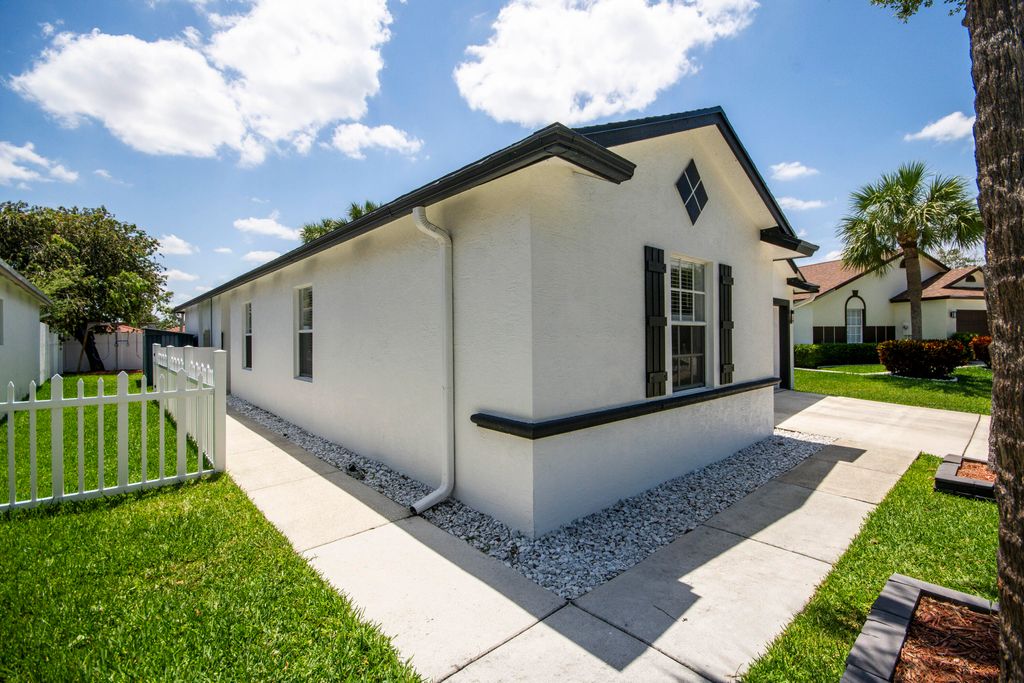 Photo of 6036 Azalea Circle, West Palm Beach, FL 33415 (MLS # B26025166)