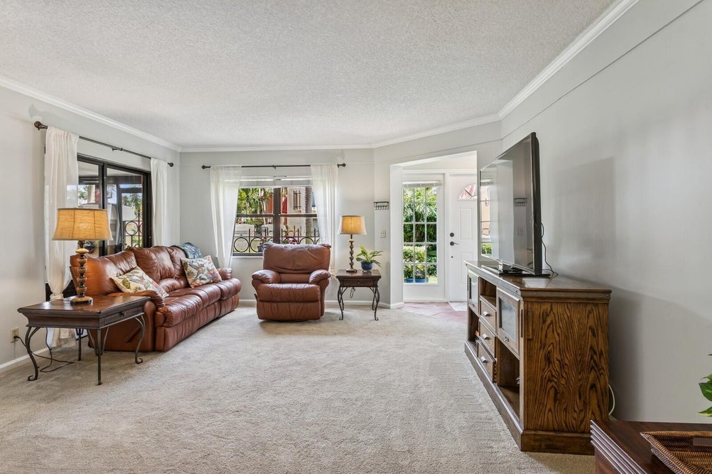 Photo of 24 Uno Lago Drive, Juno Beach, FL 33408 (MLS # B26042107)