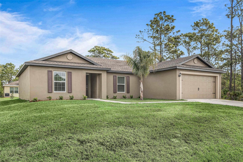 Photo of 1926 SW Davis Street, Port Saint Lucie, FL 34953 (MLS # F10427858)