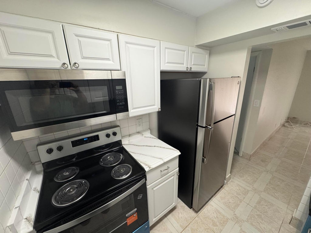 Photo of 1758 Abbey Road #102, West Palm Beach, FL 33415 (MLS # B26078819)