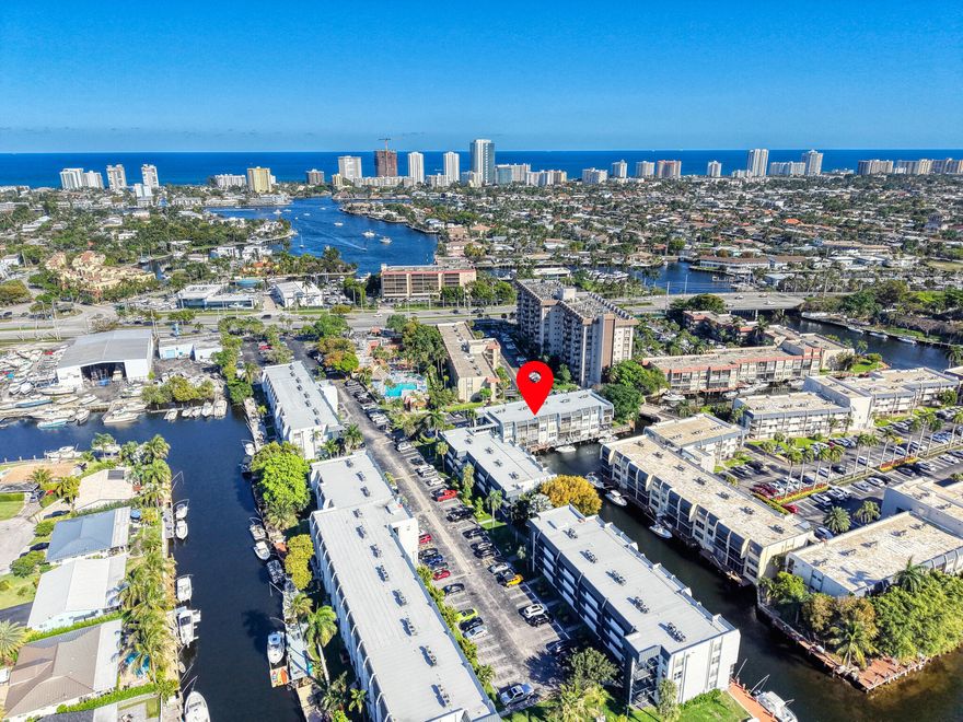 BEST VALUE in Island Club on TOP-FLOOR and Move-in Ready. This 2/2 residence is the ONLY unit currently for sale that offers a LONG, tranquil water view from both the living room and primary bedroom, with added privacy and less noise. Bright open kitchen with island and abundant cabinetry flows into spacious living and dining areas. Smart appliances: stove & microwave. Elevator building, laundry on each floor, and steps to the pool and clubhouse. Gated community with 24-hour manned security, two heated pools, sauna, hot tub, fitness center, courtesy bus, putting green, grills, and lush grounds. Just minutes to beaches, Pompano Pier, Lauderdale-by-the-Sea, dining, and shopping. Ideal to move in or rent out. 40 & 50-year inspections complete! NO DEEDED DOCK Top-floor BEST VALUE in Island Club and move-in ready. This 2/2 is the only current listing offering a long, peaceful water view from both living room and primary bedroom, providing added privacy and reduced noise. Open kitchen with island and generous cabinetry connects to spacious living and dining areas. Smart appliances include stove & microwave (stove features air fryer function) and refrigerator with filtered ice maker. Elevator building with laundry on each floor, conveniently located steps from pool and clubhouse. Gated community offers 24-hour manned security, two heated pools, sauna, hot tub, fitness center, courtesy bus, putting green, grills, and beautifully maintained grounds. Minutes to beaches, Pompano Pier, Lauderdale-by-the-Sea, dining, and shopping. Great for end users or investors. 40 & 50-year inspections completed. WiFi included in association fee. NO DEEDED DOCK.