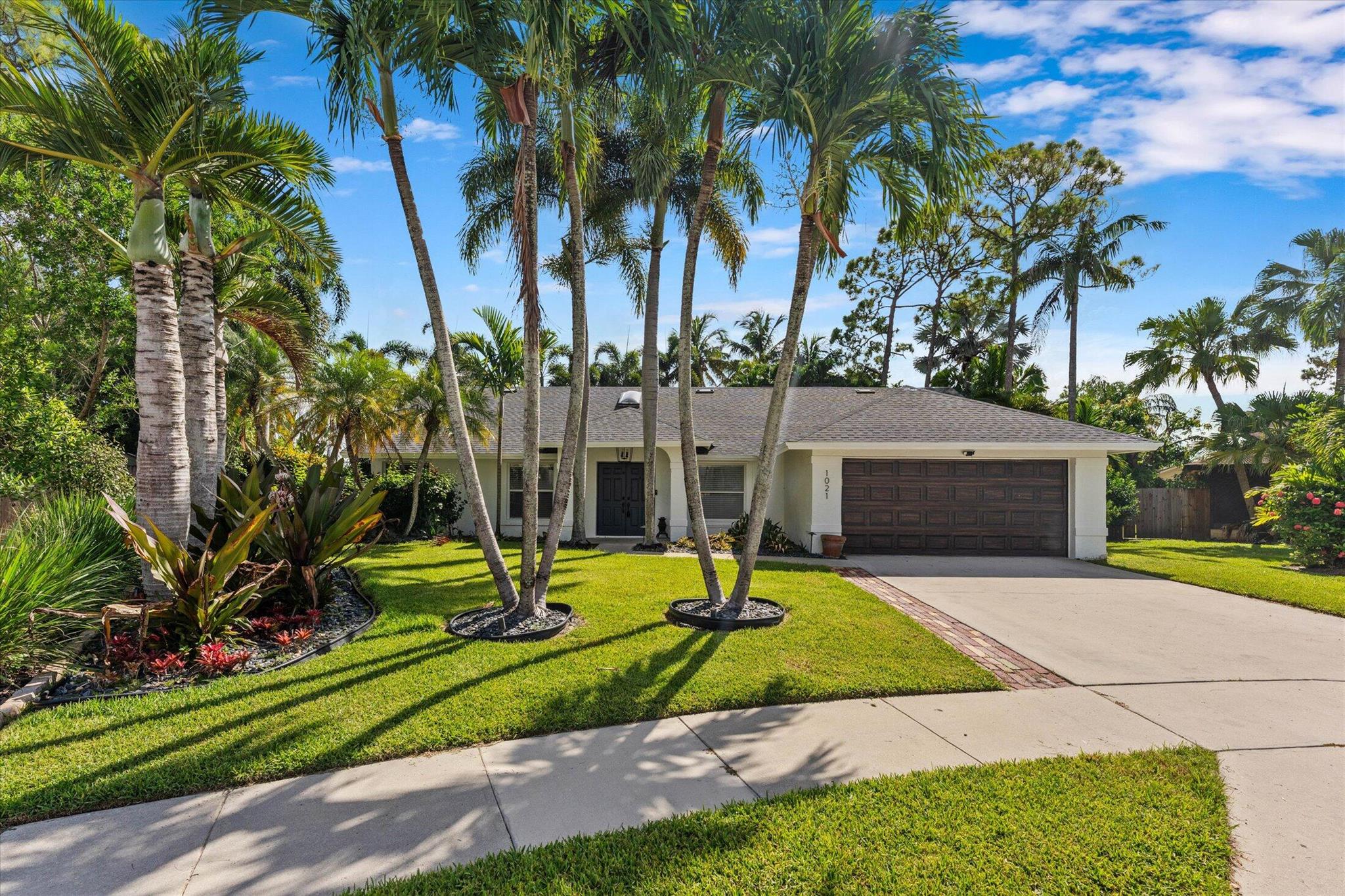 Move right in to this stunning 4BR/2BA pool home in Sugar Pond Manor, tucked away on a quiet cul-de-sac for ultimate privacy. Freshly painted with a brand-new roof, this home features a spacious split floor plan, tile throughout, a sleek modern kitchen with pantry & coffee bar, and a bright family room with built-in bar perfect for entertaining. Enjoy your screened, heated pool & spa surrounded by lush landscaping in a fully fenced yard lawn and pool care included! Whole-house generator & full storm protection. Prime location walking distance to A-rated schools, parks, and shops, with no HOA. Pets welcome!