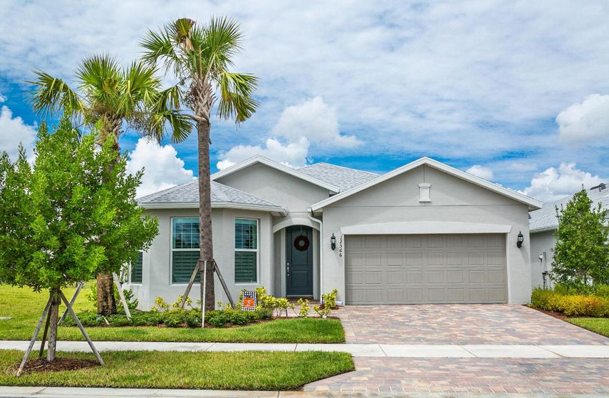 Why wait for new construction? This highly appointed 3/2/2 Marina model built in 2020 by Pulte is ready and waiting for you! Located on a premium lakeview lot, this beautiful home boasts plenty of upgrades including new open concept floor plan, impact windows throughout, wood plank tile flooring throughout the home, crown molding, recessed lighting, plantation shutters, upgraded cabinets, extend kitchen island, subway tile backsplash upgraded appliances, granite countertops, extended covered patio and more. Master bedroom is spacious and complimented with tray ceiling, large walk in closet, upgraded huge master shower and dual sinks  Community pool and gated entrance.  Heron Preserve is only minutes away from Tradition shops, restaurants and activities.