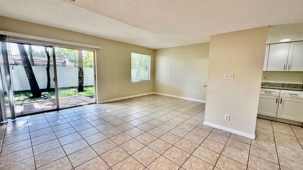 Photo of 1487 NW 94th Way, Coral Springs, FL 33071 (MLS # F10509700)