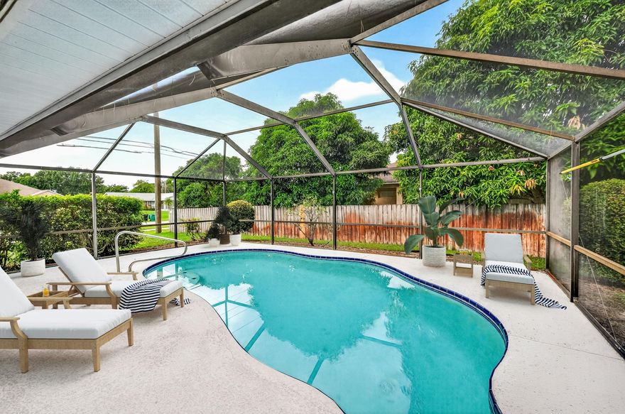 New Year, New Home! Your new life begins in this beautiful 3+den/2 bath pool home, spanning over 2,000 sq ft of comfortable living space. Soaring ceilings & skylights make it light & airy, with sliders that open up to a 42' lanai and screen enclosure. Great for indoor/outdoor Florida living around the pool! Glam kitchen with stainless appliances and bar seating flows to the family room. Split floor plan includes spacious master suite & luxe bath. New upscale laminate flooring throughout too! Updated AC and water heater. Roomy .30/acre corner lot with lots of parking space. Bring your toys!