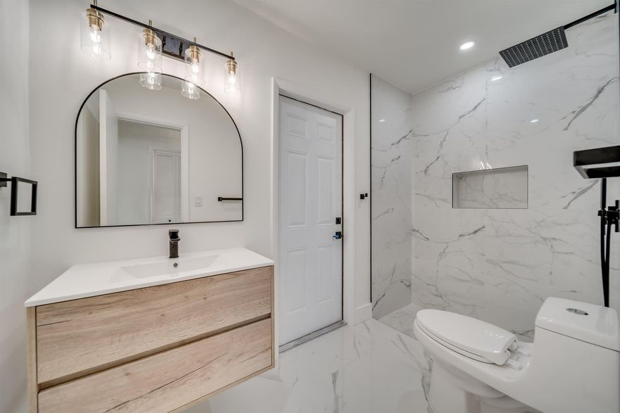 Welcome to the most beautifully updated home in the area for the price! 7251 Fairway is move in ready! Owner's suite has a large walk-in closet with closet racks, flooring throughout is Italian marble look porcelain tile, Both bathrooms are renovated with timeless large format marble look porcelain, wood accent vanities and black finishings.  Kitchen features white shaker cabinets, new stainless steel appliances & quartz countertop & backsplash. The kid's bedrooms are a good size & all closets have organization systems so hurry & unpack! The home offers a very large screened in patio to relax and or to gather lots of friends and family together. The backyard is newly sodded & is large enough to build a pool! W/D included. Water heater & AC like new. Roof good condition.