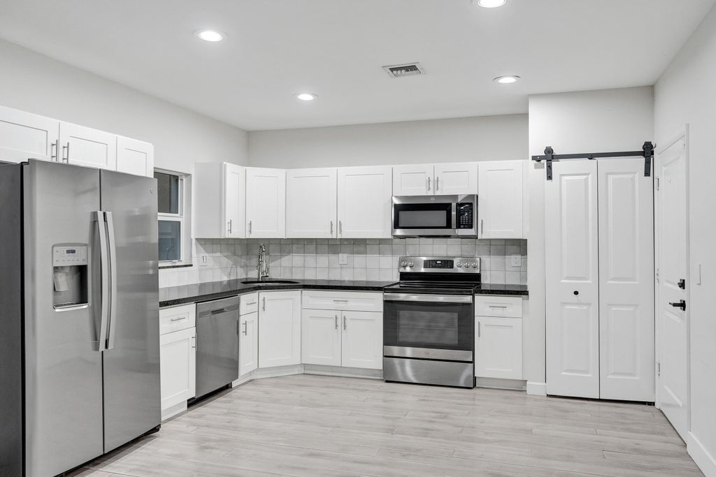 Photo of 1035 NW 2ND Avenue, Fort Lauderdale, FL 33311 (MLS # B26076015)