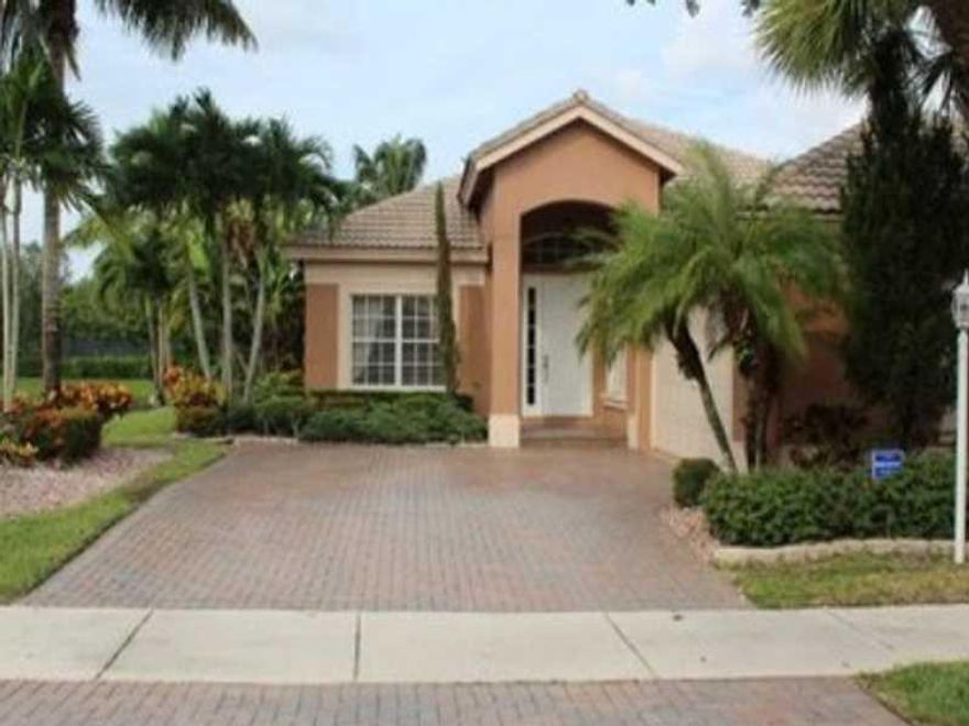 Beautifully maintained 3 Bedroom, 2 Bath Key West Model in Mystic Key - Parkland Isles. Corner water lot with great views. Guard gated community with clubhouse, heated pool & spa, basketball, exercise room, playground, teen room, plus much more. A-rated s chools.