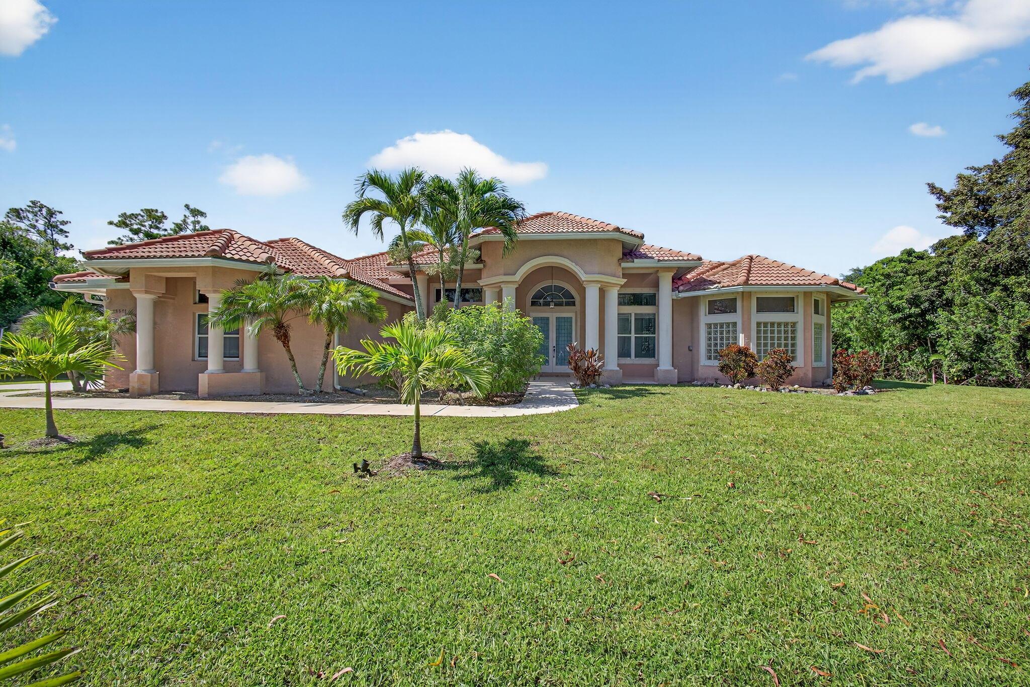 Original owner occupied custom-built 2007 home on 1.15 fully fenced acres with entry gate and 25x25 detached building. Tesla solar power system. Grand entry with double doors, architectural columns, marble inlay, and high ceilings. Freshly painted interior with formal living and dining rooms. Large island kitchen with new appliances opens to spacious great room. Split bedroom layout for privacy. Fully landscaped property with mature vegetation for added seclusion. Free-form custom pool in its own gated area within the yard. Ideal layout for family living or multigenerational needs. 2 Car garage with open parking on concrete drive for 8 cars. Roof and driveway just professionally cleaned. Traffic quieted no through street access and excellent schools.