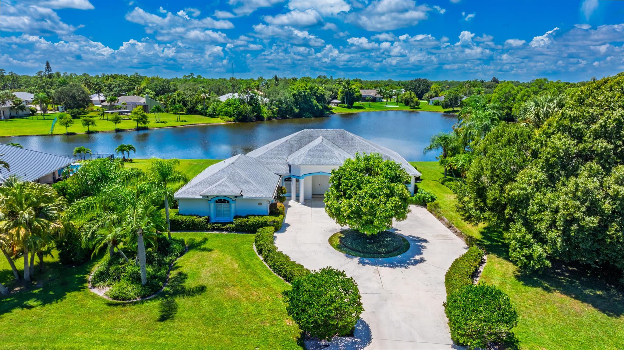 Welcome to South Fork Estates! This 3BR/3BA CBS pool home over half an acre with picturesque lake views. Featuring a split floor plan with 2 en-suite bedrooms perfect for guests, plus a flex room that can easily serve as a 4th bedroom or office. Home features vaulted ceilings, an open kitchen with breakfast nook and spacious living areas filled with natural light. The outdoor oasis includes a screened pool and covered patio perfect for relaxing or entertaining. Additional highlights include: a whole-house generator with a 1,000-gallon buried propane tank, 2017 roof, 2018 hot water heater, oversized 2-car garage, and low HOA fees with access to community parks and boat/RV storage. Conveniently located in South Stuart near I-95, shopping, dining, and Martin County's top-rated schools.
