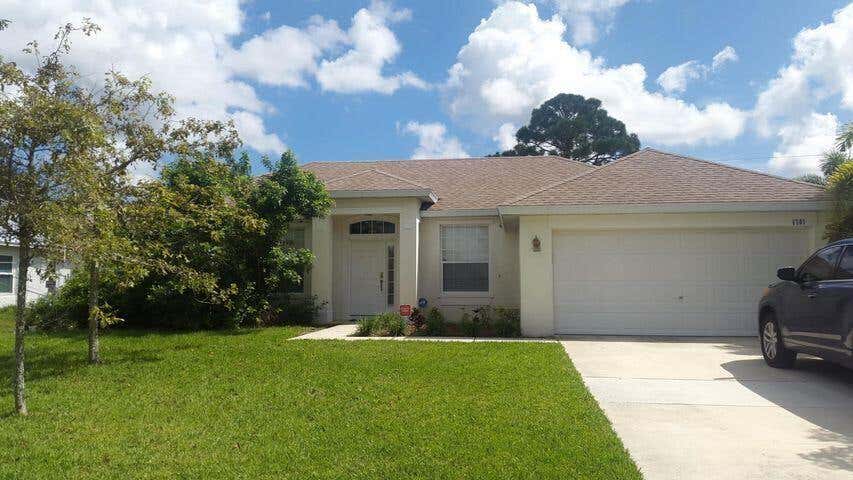 Photo of 1701 SW Victor Lane, Port Saint Lucie, FL 34984 (MLS # R10925868)