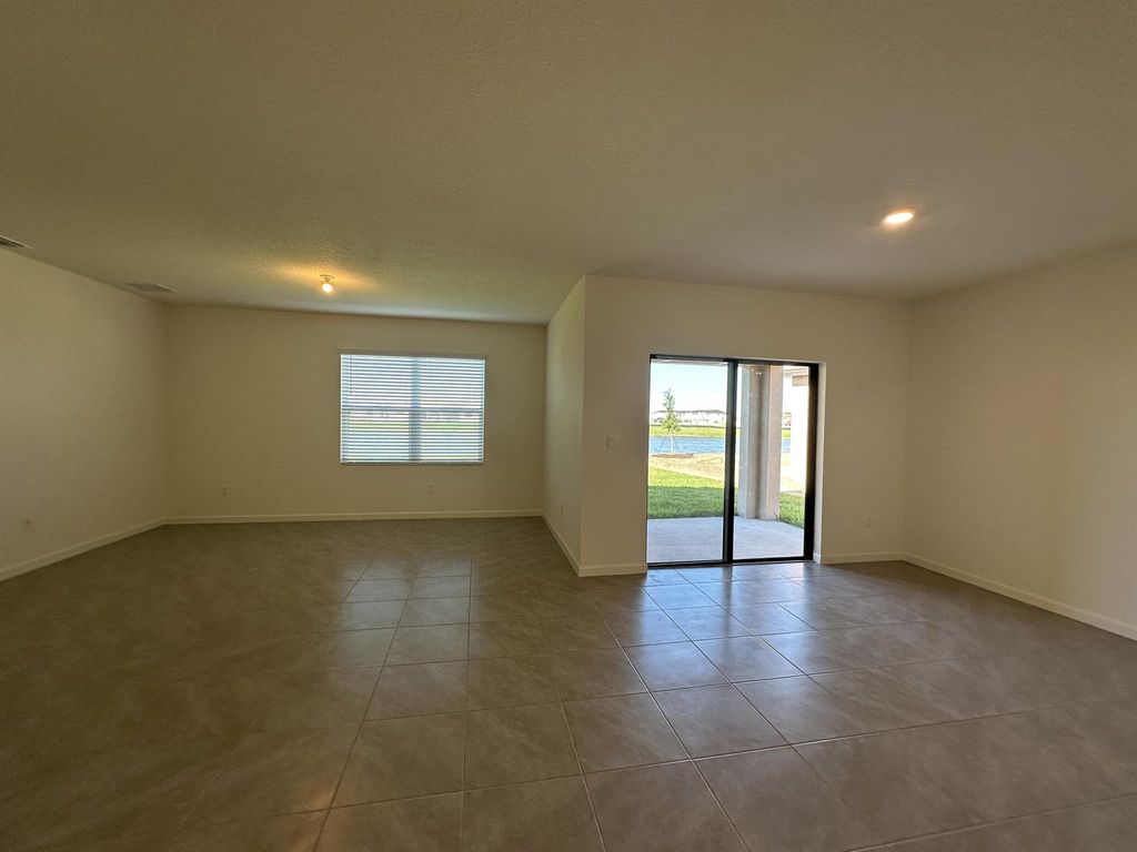 Photo of 9760 SW Triton Way, Port Saint Lucie, FL 34987 (MLS # R10974523)