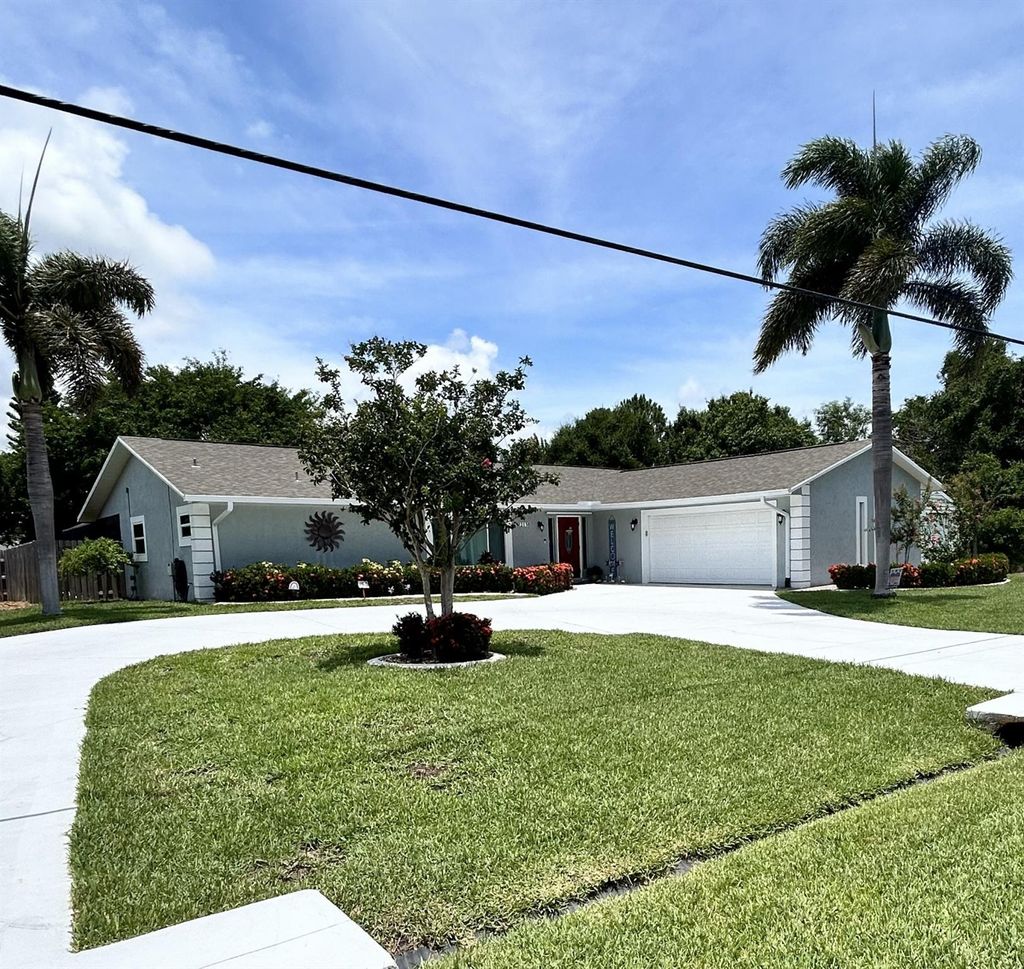 Photo of 2130 SE Elmhurst Road, Port Saint Lucie, FL 34952 (MLS # F10446527)