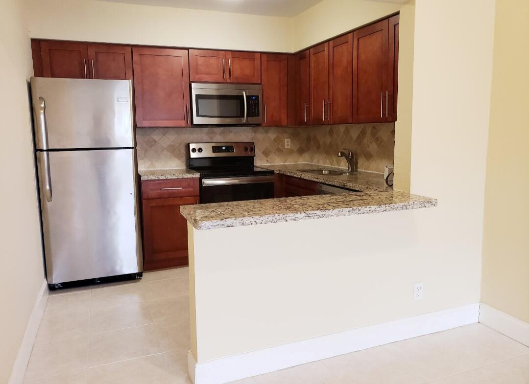 Updated Freshly Painted 2 Bedroom / 1 Bathroom with Beautiful Remodeled Kitchen with Granite Counter tops & SS appliances. Tile in living room and laminate in bedroom with Updated Bathroom. Front parking. Rent includes water, trash, sewer and laundry room access on premises. *Ready to move-in conditions* Fast Approval* Close to I-95, Shopping Centers and 15 mins to Relaxing Beaches.