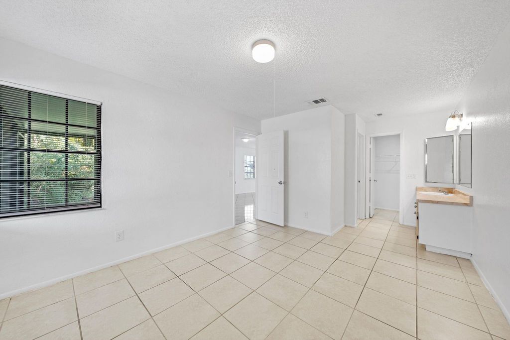 Photo of 390 SW Colesbury Avenue, Port Saint Lucie, FL 34953 (MLS # F10467405)