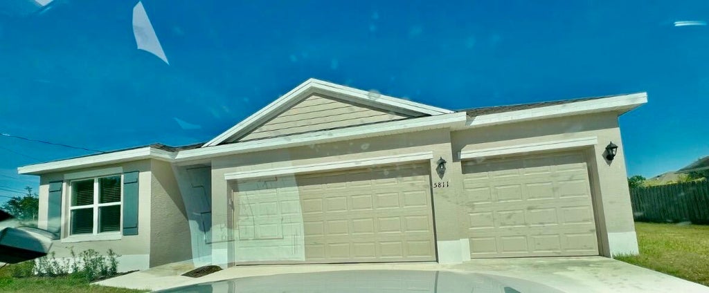Photo of 5811 NW GERALD Circle, Port Saint Lucie, FL 34986 (MLS # B26064901)