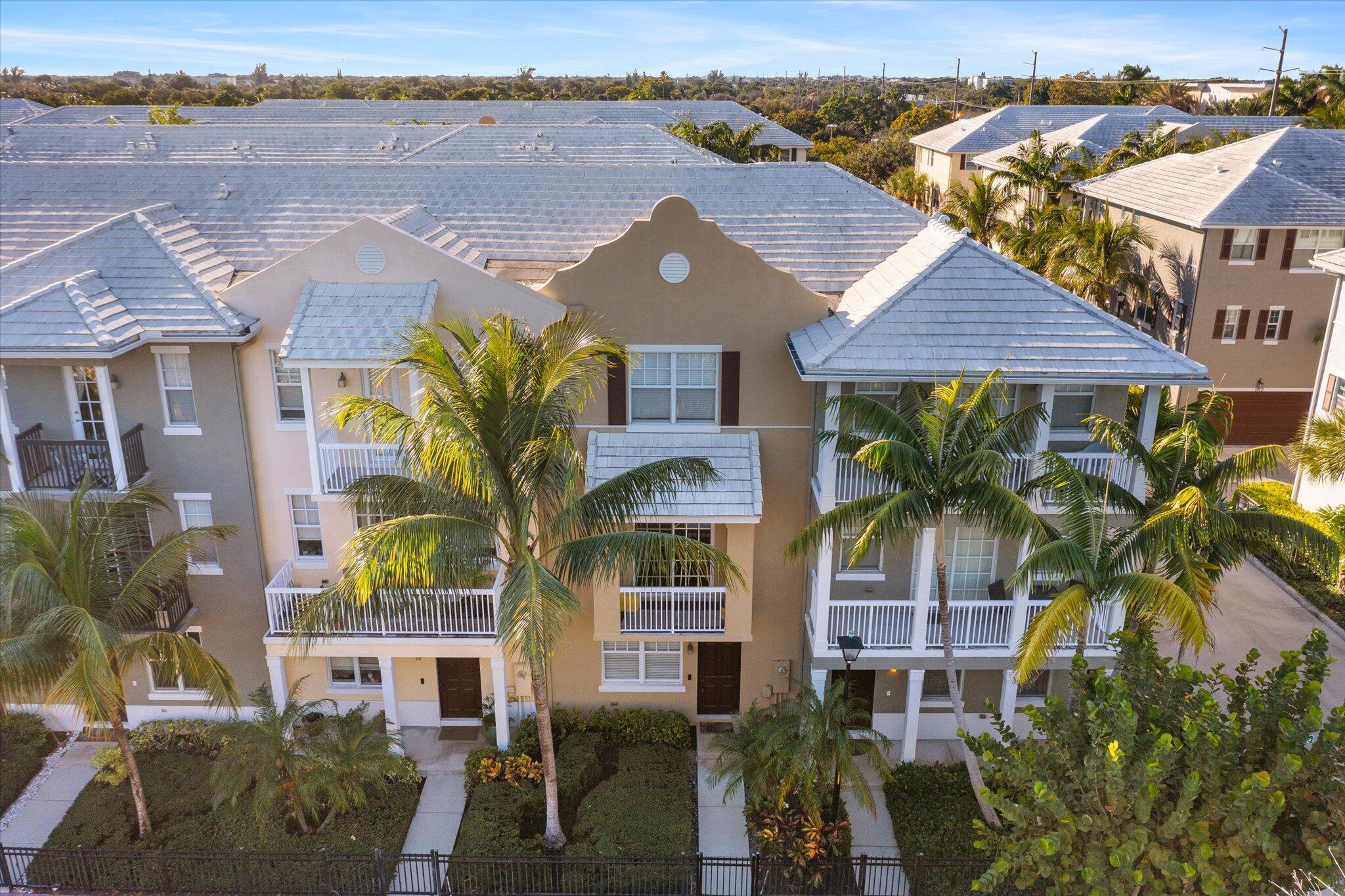 This one-of-a-kind, 3-story townhome, built in 2021, offers sophisticated living just steps from Atlantic Avenue and moments from the beach. The gourmet kitchen features top-tier stainless appliances, custom cabinetry, a wine refrigerator, Bosch dishwasher, and induction cooktop. The open-concept family room showcases a stunning custom-built entertainment center, perfect for hosting. The versatile layout includes a ground-floor bedroom with a half bath, ideal for guests or a home office. The upper floors boast a serene primary suite, two additional bedrooms with custom closets, and a convenient laundry area. Coda's amenities include a sparkling pool, sun deck, tot lot, and cabana bathrooms. With HOA services covering exterior maintenance, insurance, alarm monitoring, and