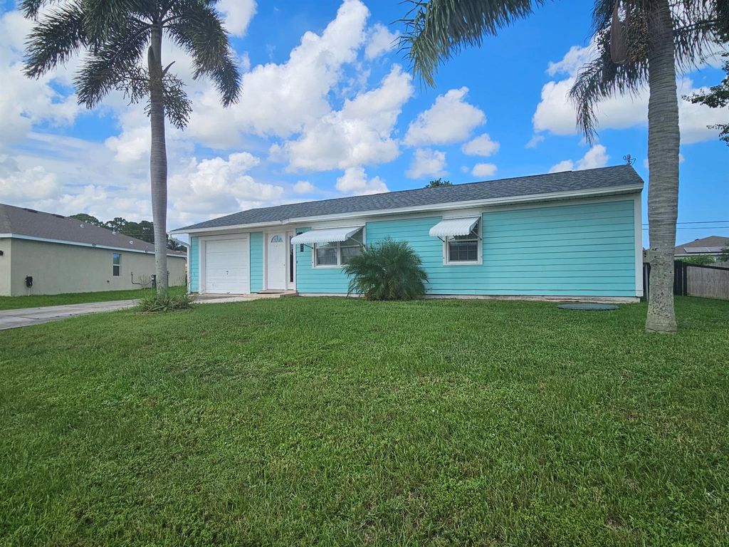 Photo of 1809 SW Idaho Lane, Port Saint Lucie, FL 34953 (MLS # R11013387)